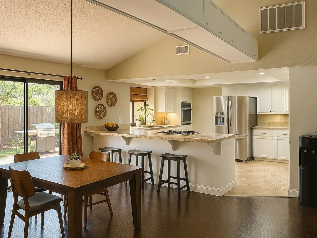 The same dining room and kitchen in Bright, evenly lit